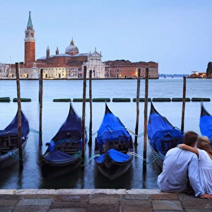 Italy, Veneto, Venice, Sestier of San Marco, Moored gondolas with San Giorgio Maggiore