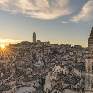The Sassi quarter at dawn, with San Pietro Barisano bell tower in the foreground. Matera