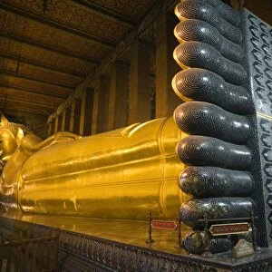 Thailand, Bangkok. Giant reclining Buddha statue at Wat Pho