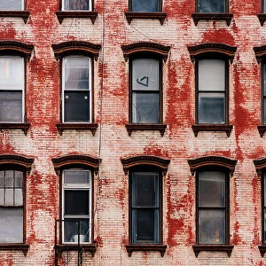 Windows and vintage briks in New York City wall, USA