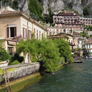 Italy, Lombardy, Lake Garda, Limone Rivera, view along waterfront with Limonaia in