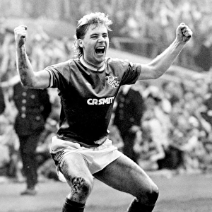 Ally McCoist's Historic Double: Securing Rangers Premier Division Title with a 3-0 Triumph over Heart of Midlothian