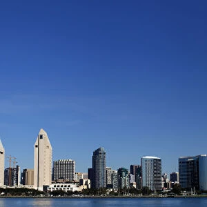 The San Diego skyline is seen from a beach in Coronado, California
