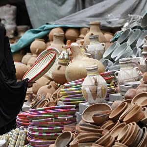 A woman shops at the old market in the historic city of Sanaa