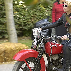 Goodwood Revival Lady riding classic bike red 2000s classic