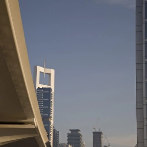 UAE, Dubai. Metro transit platform along Sheik Zayed Road, with Chelsea Tower in background