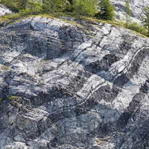 USA, Alaska, Glacier Bay National Park. Layers of striated rock on Gloomy Knob. Credit as