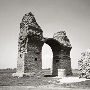 AUSTRIA: CARNUNTUM. A view of the Heidentor (Pagan Gate), a Roman triumphal arch erected for Emperor Constantius II between 354 and 361 A. D. at Carnuntum in present-day Austria. Photograph, 20th century