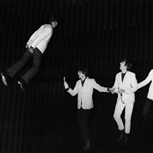 THE BEATLES, 1964. The Beatles fly above the stage during a rehearsal for the Night of 100 Stars charity show at the London Palladium, 1964. Left to right: Ringo Starr, Paul McCartney, John Lennon and George Harrison