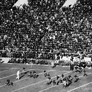 COLLEGE FOOTBALL GAME, 1921. A view of the action during a football game between Harvard