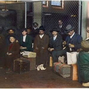 IMMIGRANTS: ELLIS ISLAND. A group of Italian men and boys at Ellis Island: photographed