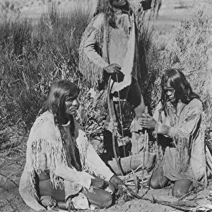 NATIVE AMERICANS: FIRE, 1872. Paiute Native Americans kindling a fire by friction