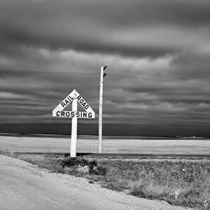 NORTH DAKOTA ROAD, 1940. Railroad crossing on a rural road in McHenry County, North Dakota. Photograph by John Vachon in October 1940