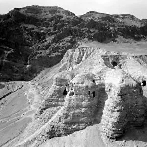 QUMRAN CAVES, c1955. Exterior of the Qumran caves, in which the Dead Sea Scrolls