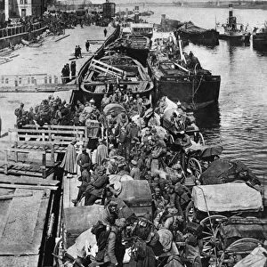 WWI: GERMAN TROOPS, c1914. The disembarkation of German troops from barges, somewhere in Europe