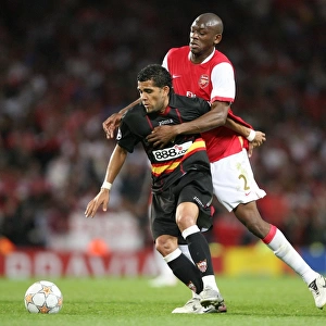 Abou Diaby (Arsenal) Daniel Alves (Sevilla)