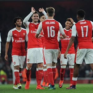 Alex Oxlade-Chamberlain celebrates scoring his 1st goal for Arsenal as Carl Jenkinson