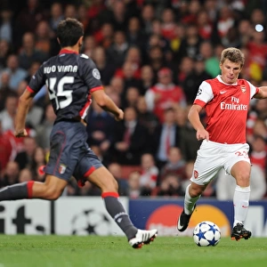 Andrey Arshavin shoots past Braga goalkeeper Felipe to score the 2nd Arsenal goal