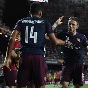 Arsenal's Aubameyang and Monreal Celebrate Goal in Europa League Semi-Final vs Valencia