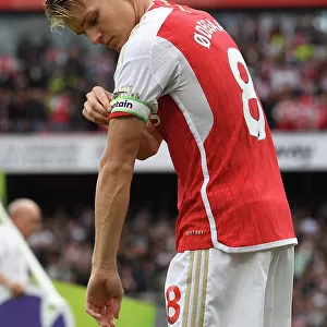 Arsenal's Martin Odegaard Faces Off Against Tottenham in the 2023-24 Premier League Showdown at Emirates Stadium