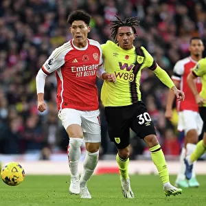 Arsenal's Tomiyasu Fends Off Burnley's Pressure in Premier League Clash