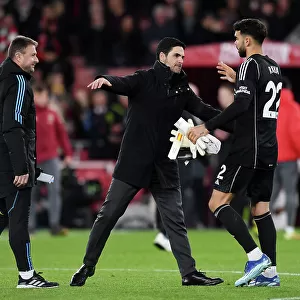 Arsenal's Victory: Mikel Arteta Celebrates with David Raya after Arsenal v Burnley in 2023-24 Premier League