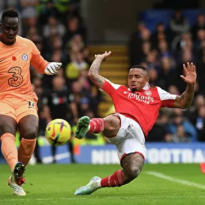 Clash at Stamford Bridge: Arsenal's Gabriel Jesus Harasses Chelsea's Edouard Mendy in Premier League Showdown (2022-23)