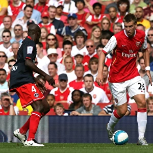 Nicklas Bendtner (Arsenal) Youssuf Mulumbu (PSG)
