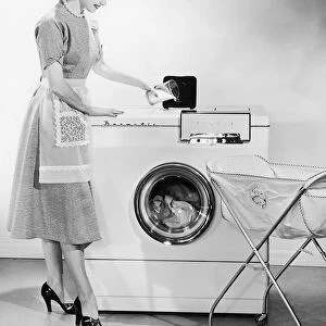Homemaker washing laundry
