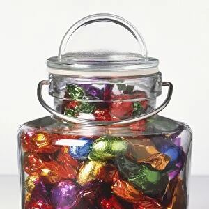 Sweet jar filled with wrapped sweets