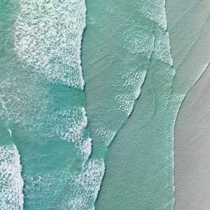 Drone photo showing waves from the Southern Ocean washing onto a beach, Lucky Bay, Esperance, Western Australia, Australia