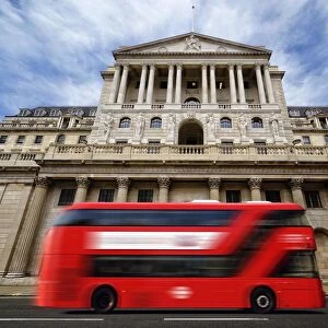 Bank of England with a passing red London double-decker bus, London, England, United Kingdom