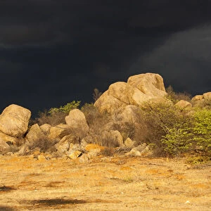 Dark storm front over rocks, Kaokoland, Kunene, Namibia