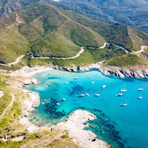 Scenic seascape and road near Anse d Aliso, Corsica, France