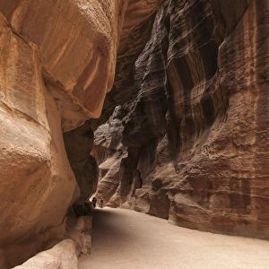 The Siq, the narrow canyon snakes its way towards Petra, Jordan