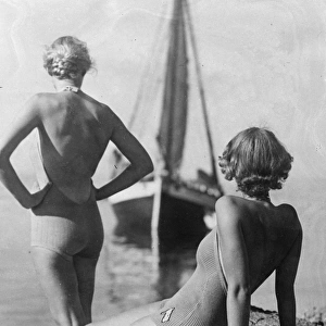 Bathing costumes in brief. Backless bathing costumes will be the fashion for frauleins