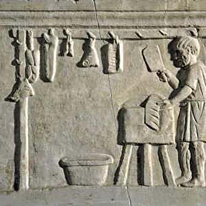 Butcher working in his shop, 2nd century (stone relief)