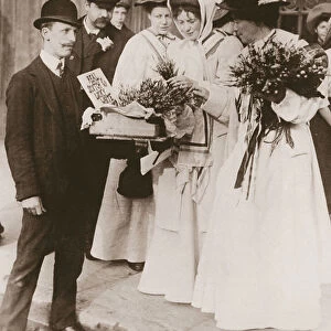 Christabel Pankhurst and Emmeline Pethick Lawrence purchasing Scottish heather for the release of Mary Philips, 18th September, 1908 (sepia photo)