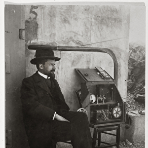 Gustave Ferrie beside his first TSF machine, c. 1900 (photo)