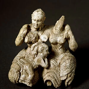 Two Mycenaean deities and a child. 1500 BC (Ivory sculpture)
