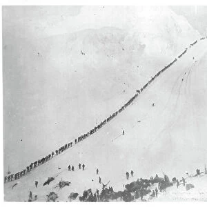 Packers ascending summit of Chilkoot Pass, during the Klondike Gold Rush (1897-98) 1898 (b/w photo)