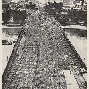 Railway tracks on the bridge across the River Thames from Cannon Street Station, terminus of the Southern Railway in the City of London (b / w photo)