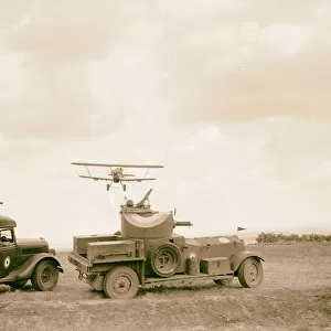 R. A. F activities Plane immediately armoured car