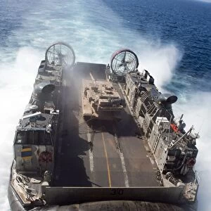 A landing craft air cushion transits the Pacific Ocean at high speed