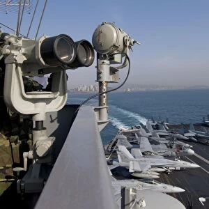 Operations Specialist Seaman stands as lookout watch on USS Carl Vinson