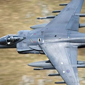 A Royal Air Force Harrier GR9 flying low over North Wales