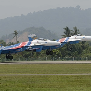 Two Sukhoi Su-27 Flanker of the Russian Knights aerobatic team taking off