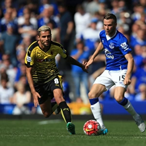 Intense Rivalry: Cleverley vs Behrami's Battle for Ball Possession (Everton vs Watford, Premier League)