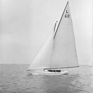 The 6 Metre class Sans-Souci sailing upwind. Creator: Kirk & Sons of Cowes