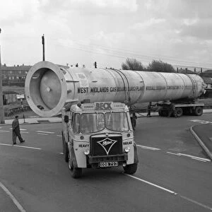 An absorption tower being transported by road, Dukenfield, Manchester, 1962. Artist